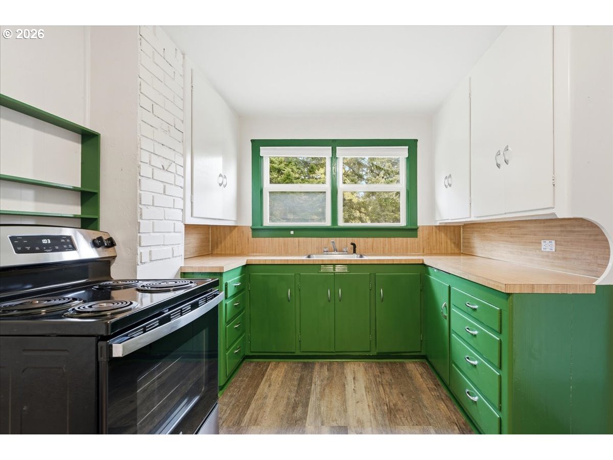 51 Wilkinson Street Carson, WA 98610 - Photo 20 of 37 a kitchen with a sink a stove and a window