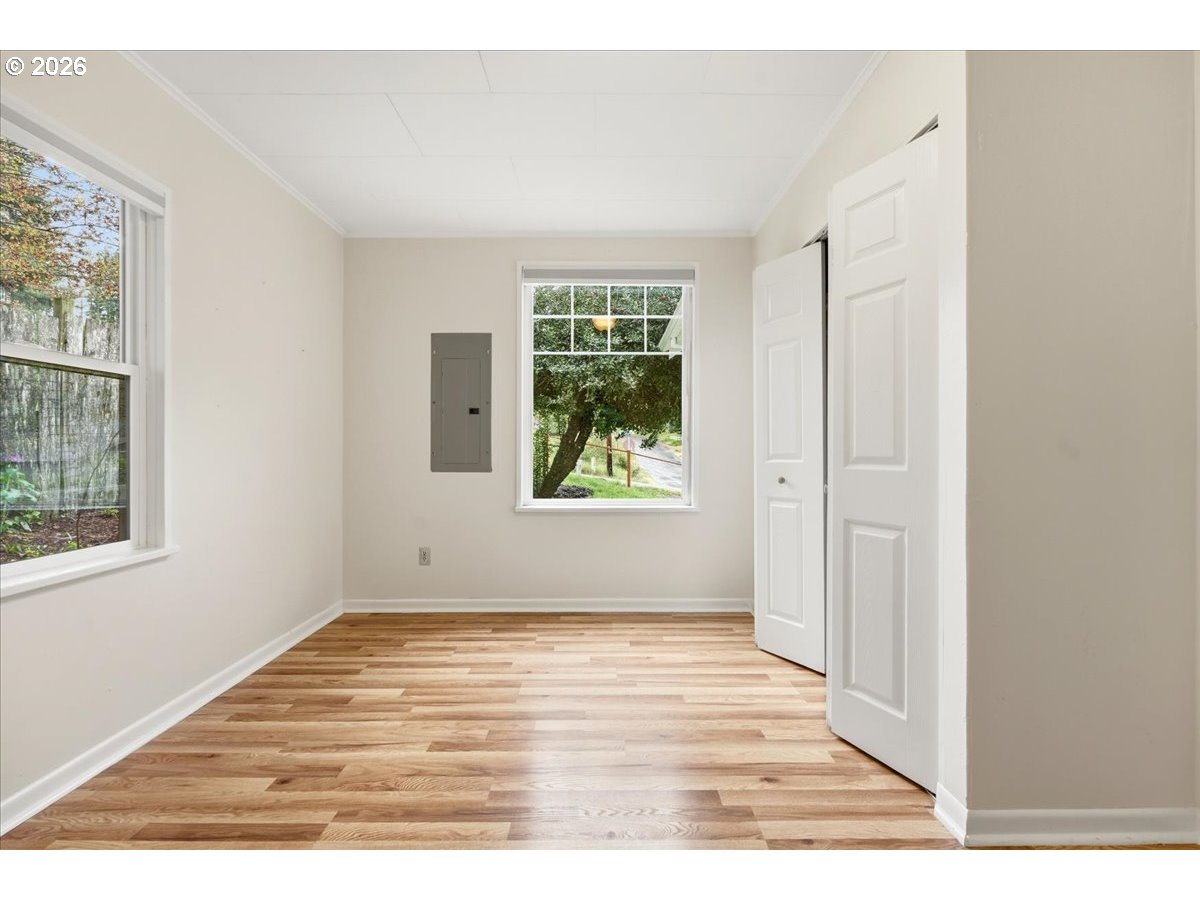 51 Wilkinson Street Carson, WA 98610 - Photo 29 of 37 a view of an empty room with wooden floor and a window