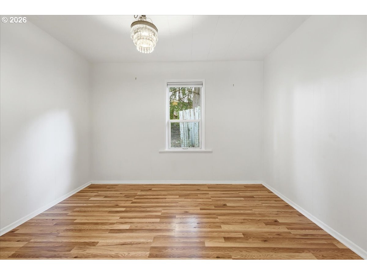 51 Wilkinson Street Carson, WA 98610 - Photo 31 of 37 a view of empty room with wooden floor