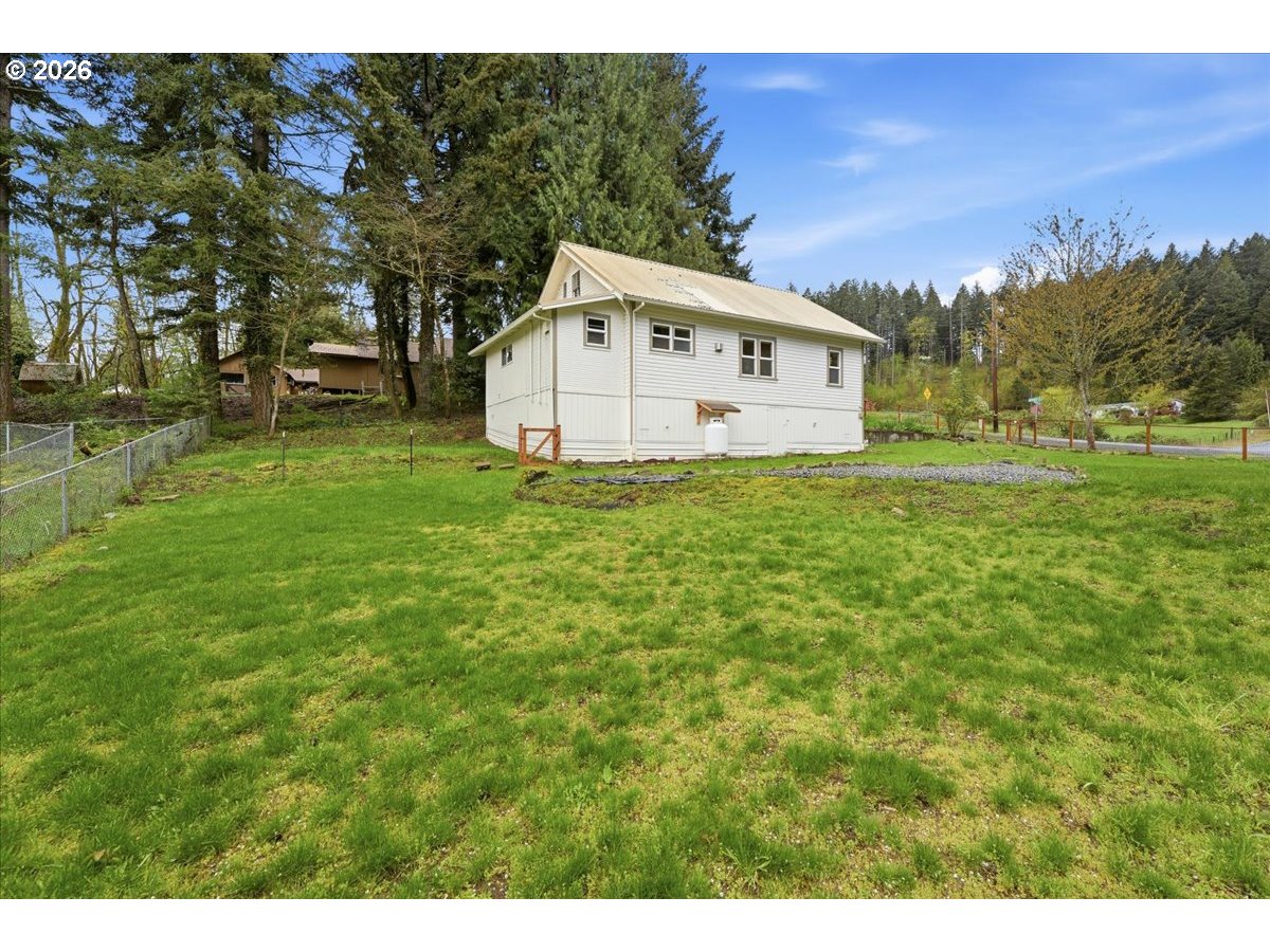 51 Wilkinson Street Carson, WA 98610 - Photo 4 of 37 a view of a house with a yard