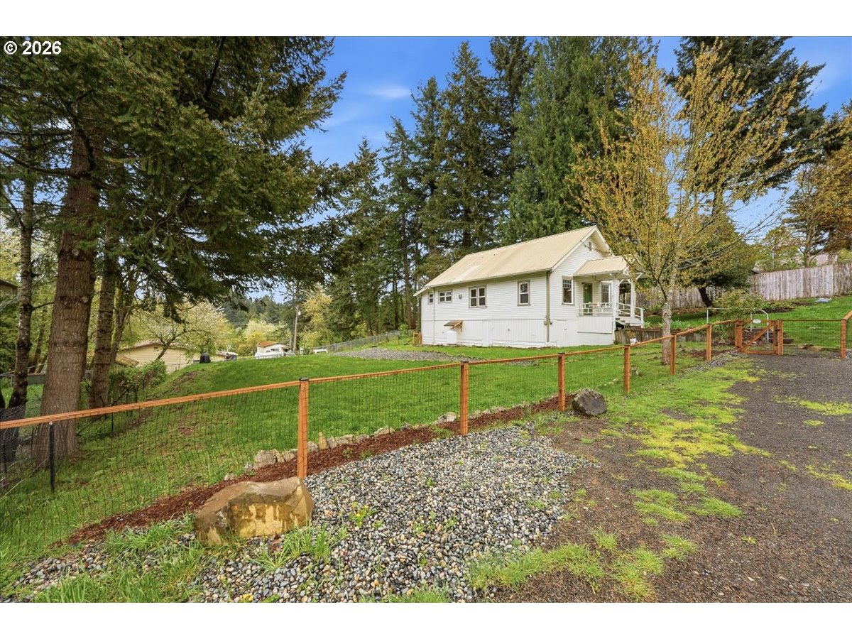51 Wilkinson Street Carson, WA 98610 - Photo 7 of 37 a view of an house with backyard space and garden