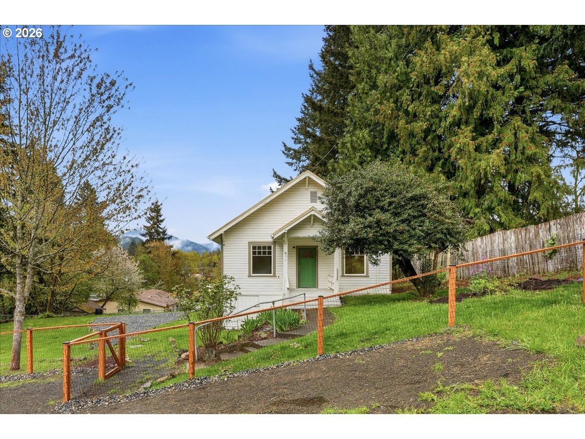 51 Wilkinson Street Carson, WA 98610 - Photo 8 of 37 a view of a yard in front of a house with large trees
