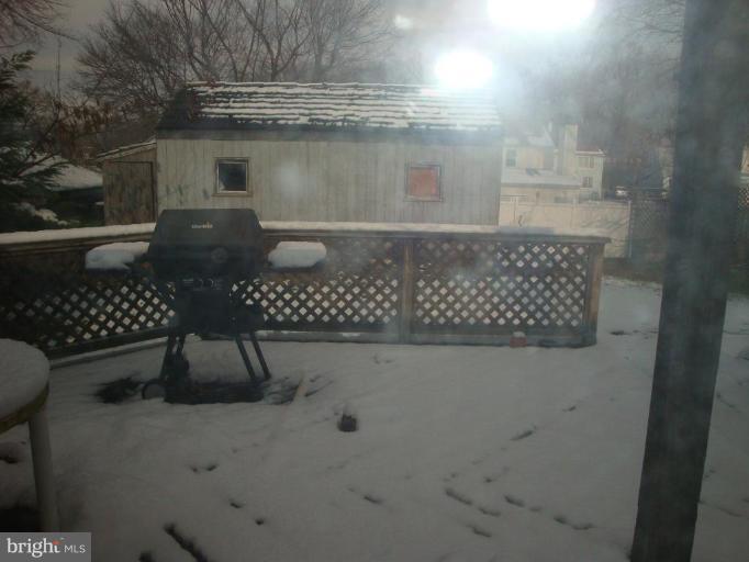 2713 Terrapin Road Silver Spring, MD 20906 - Photo 8 of 10 a bathroom with a glass shower door