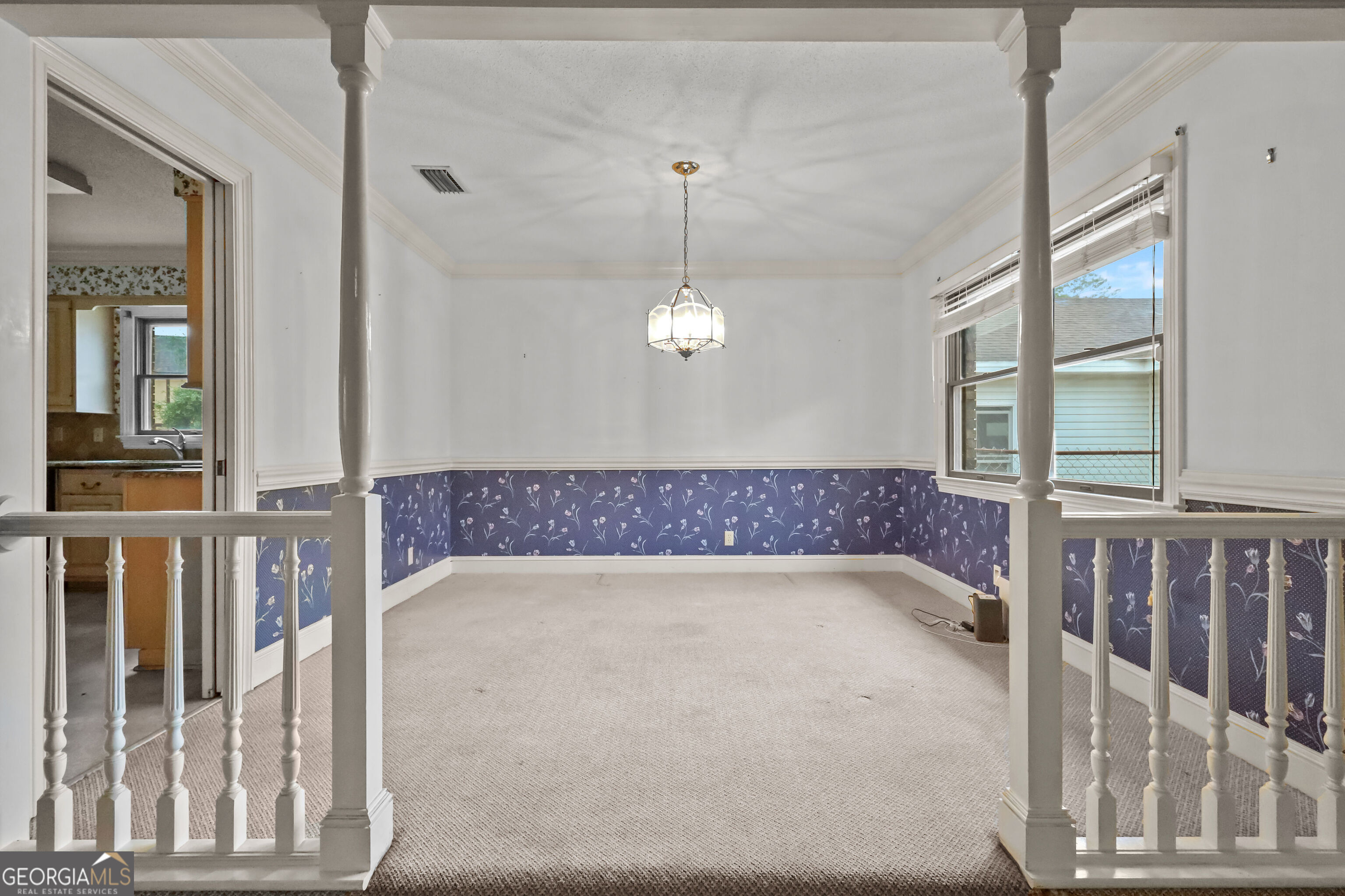 103 Cartwright Circle Brunswick, GA 31525 - Photo 14 of 54 a view of a hallway with a chandelier
