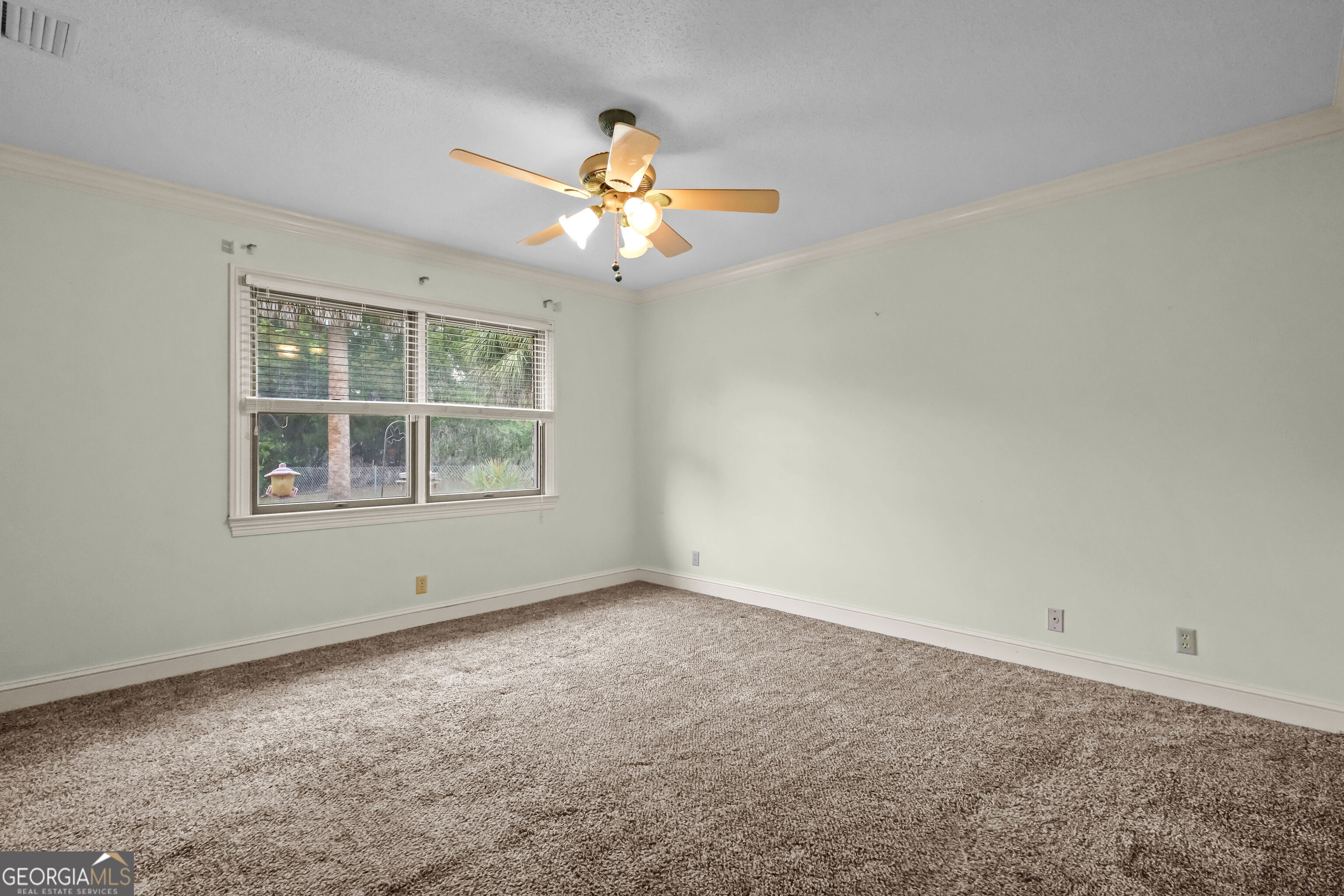 103 Cartwright Circle Brunswick, GA 31525 - Photo 26 of 54 a view of an empty room with a window