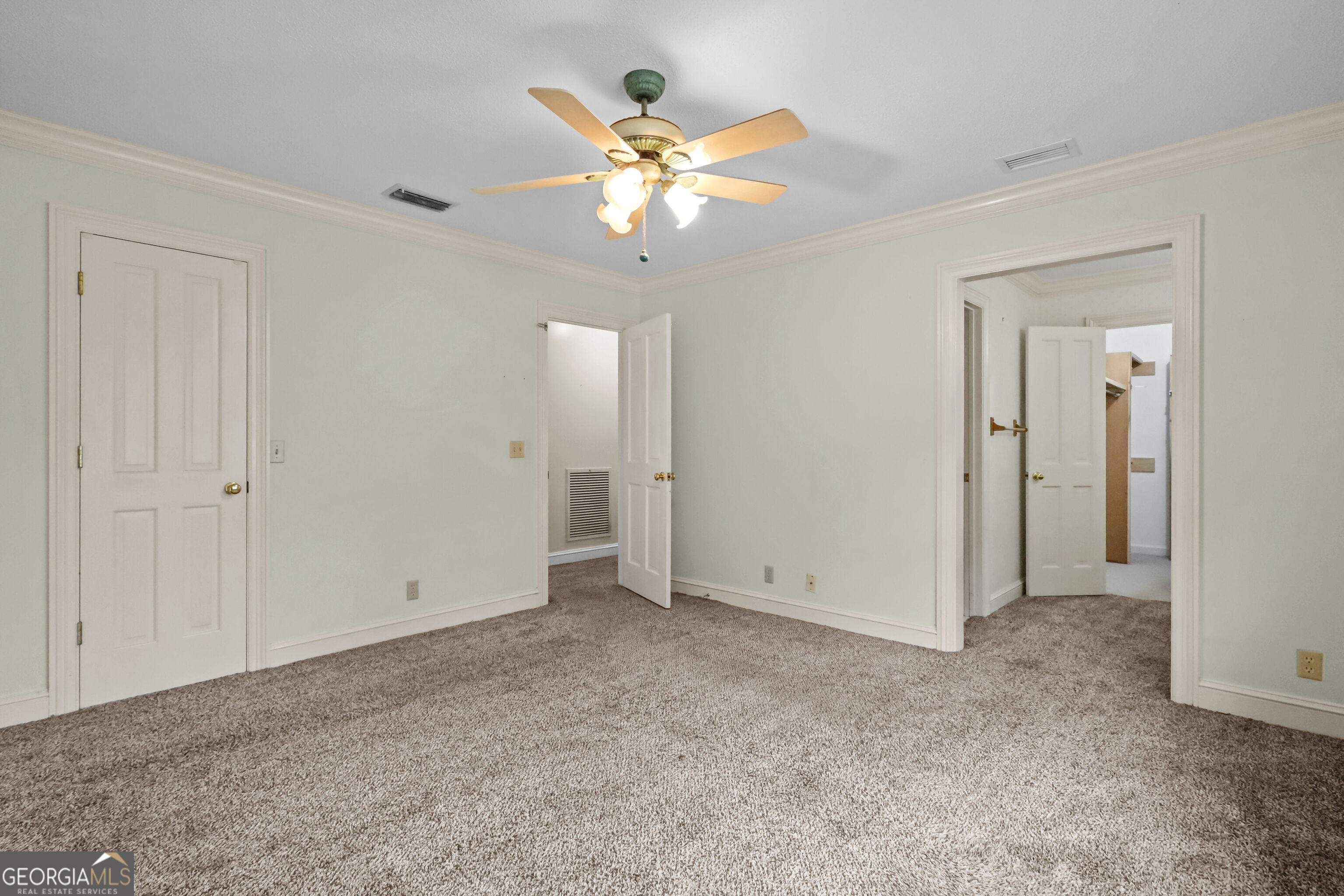 103 Cartwright Circle Brunswick, GA 31525 - Photo 27 of 54 an empty room with closet and a ceiling fan