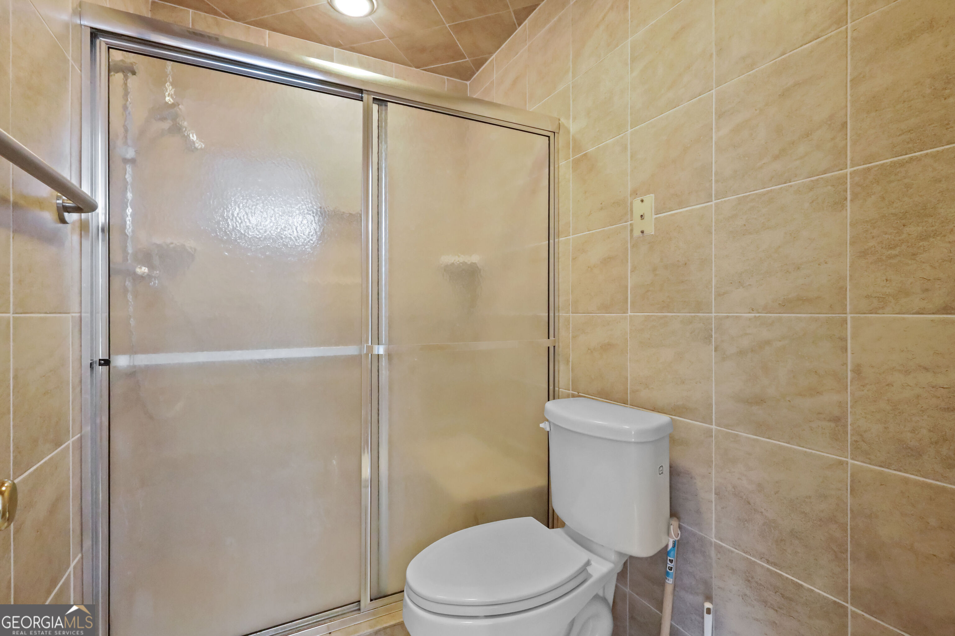 103 Cartwright Circle Brunswick, GA 31525 - Photo 30 of 54 a bathroom with a shower a toilet and a sink