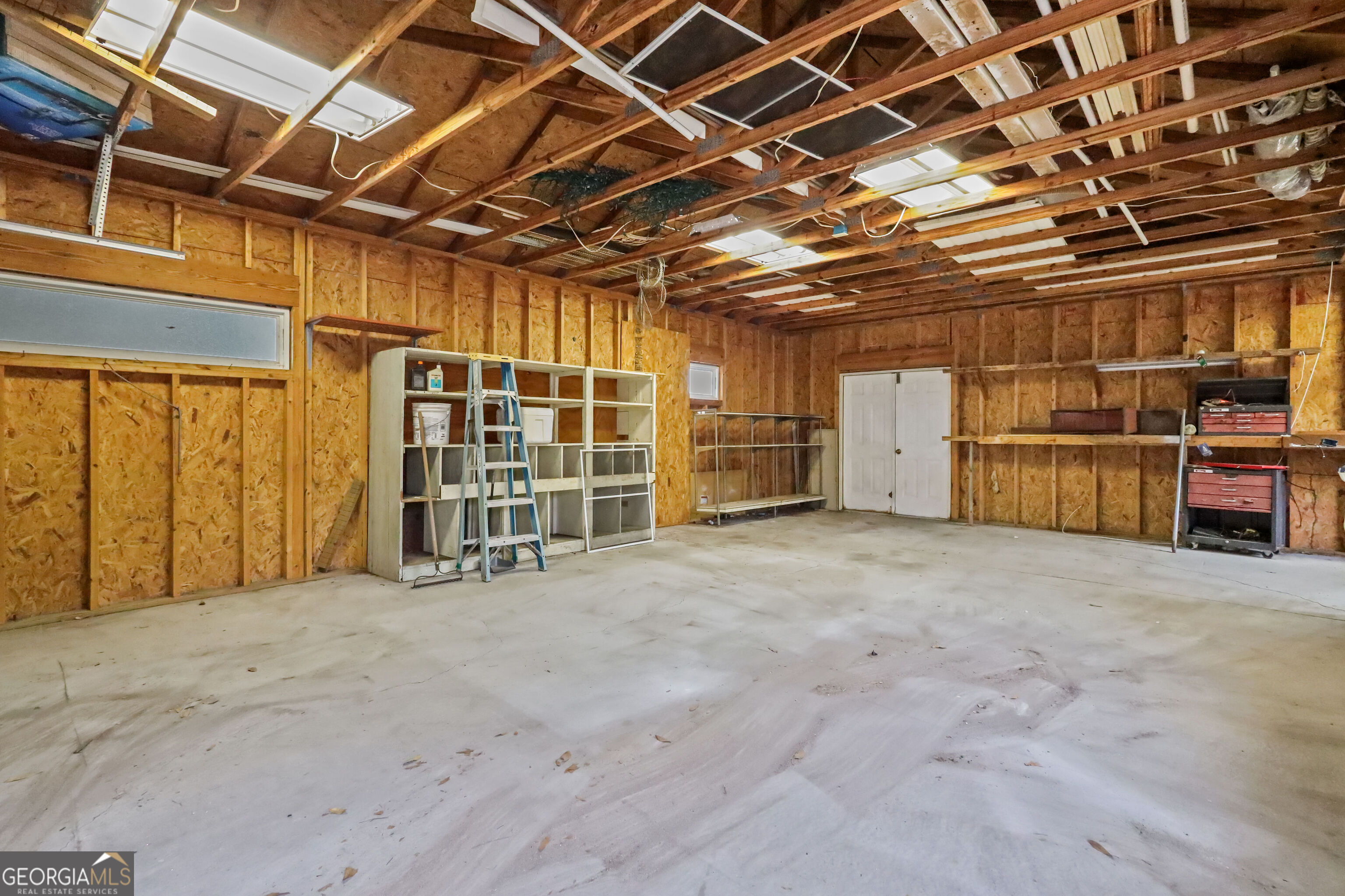 103 Cartwright Circle Brunswick, GA 31525 - Photo 37 of 54 a view of empty room with wooden ceiling