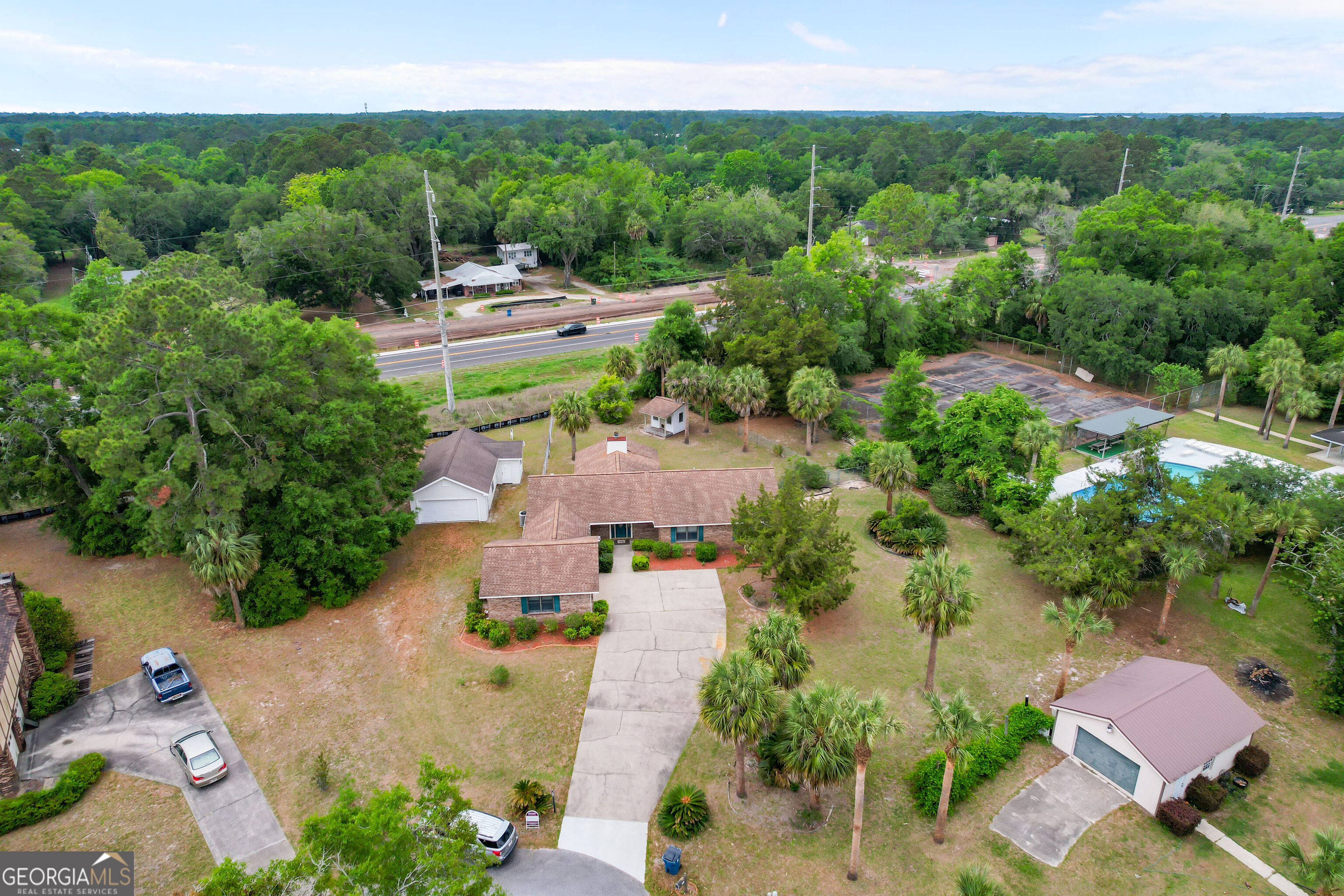 103 Cartwright Circle Brunswick, GA 31525 - Photo 41 of 54 an aerial view of a house with garden space and street view