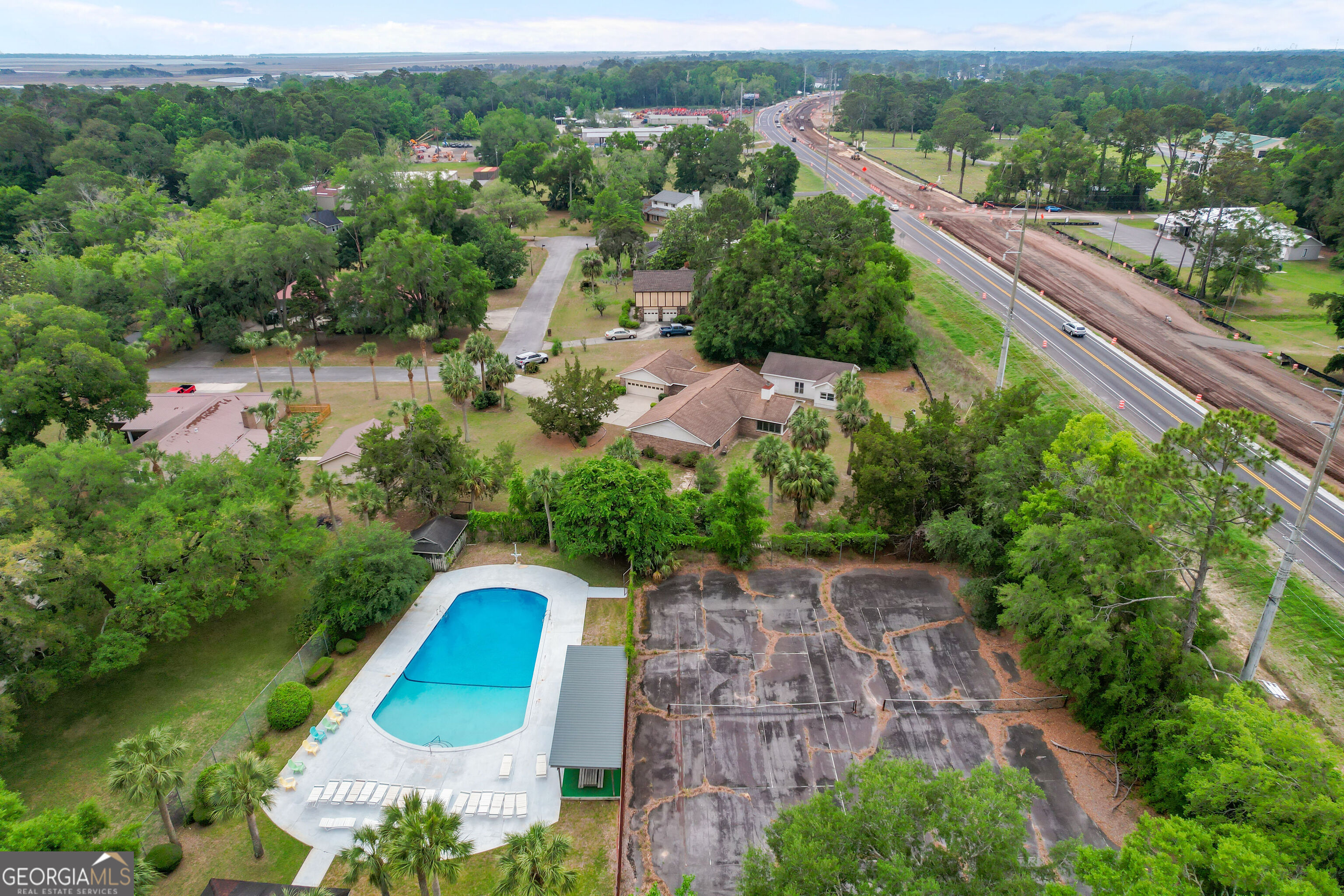 103 Cartwright Circle Brunswick, GA 31525 - Photo 43 of 54 an aerial view of a house with a garden and lake view