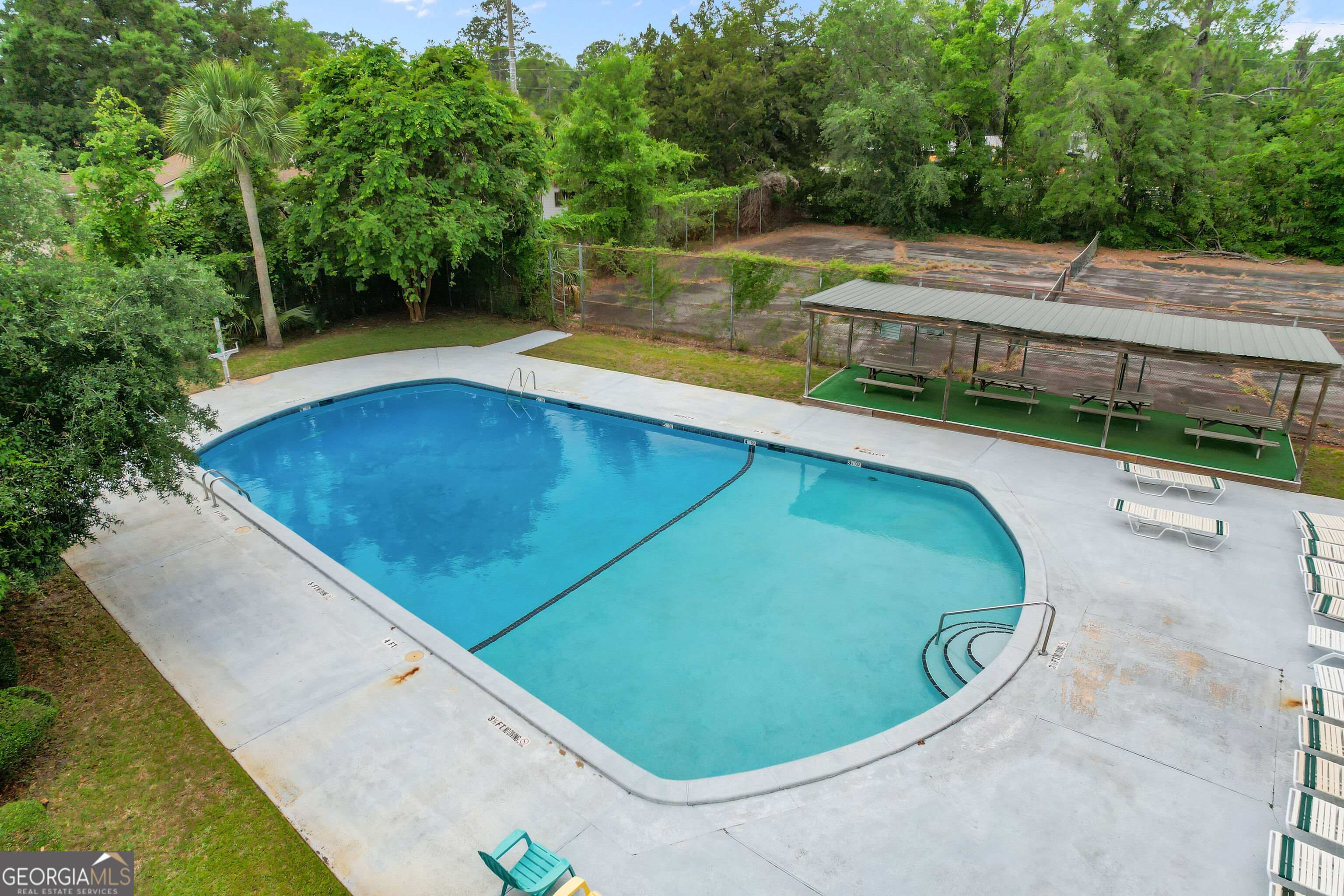 103 Cartwright Circle Brunswick, GA 31525 - Photo 45 of 54 a view of a swimming pool with a patio