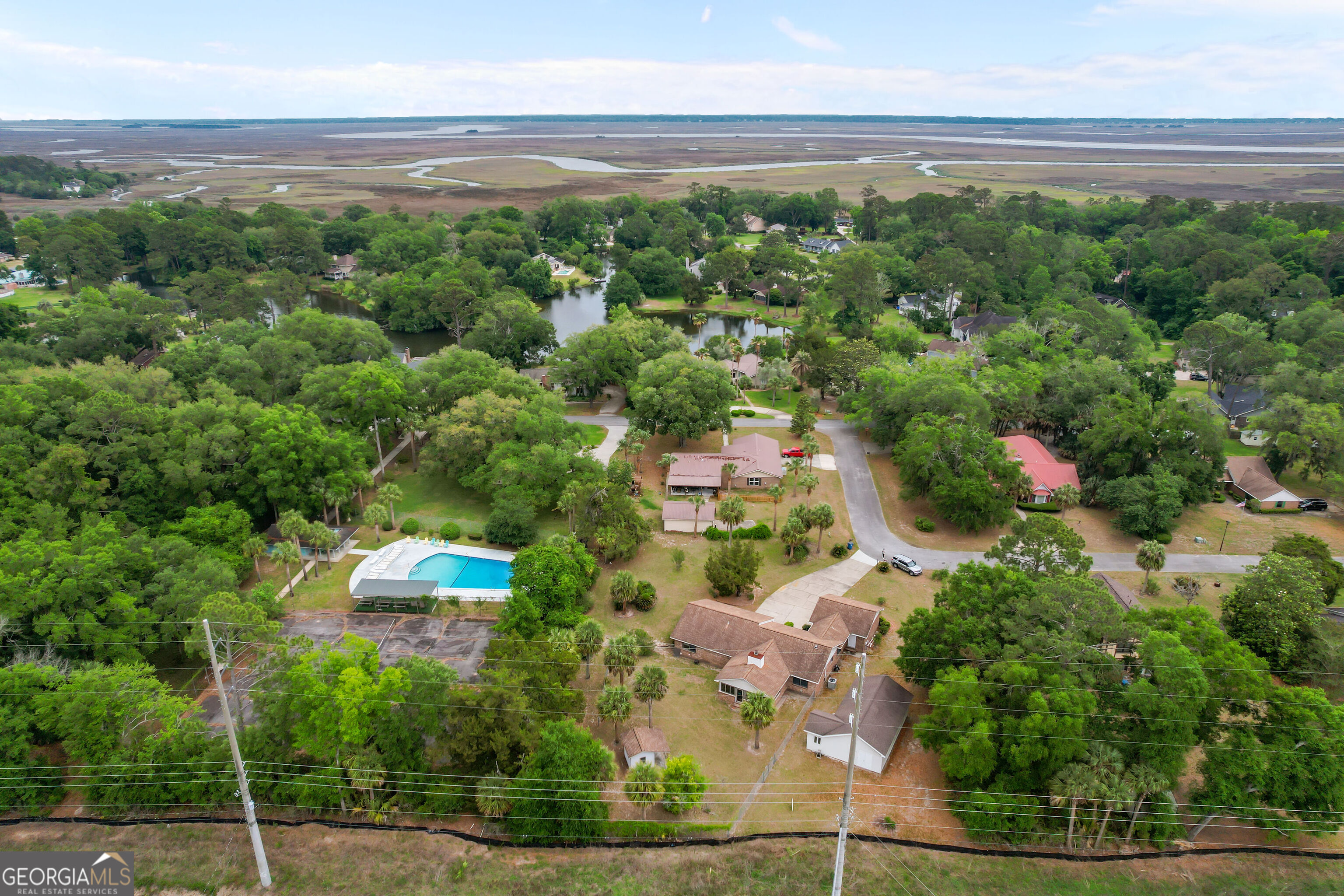 103 Cartwright Circle Brunswick, GA 31525 - Photo 47 of 54 an aerial view of a house with a yard and lake view