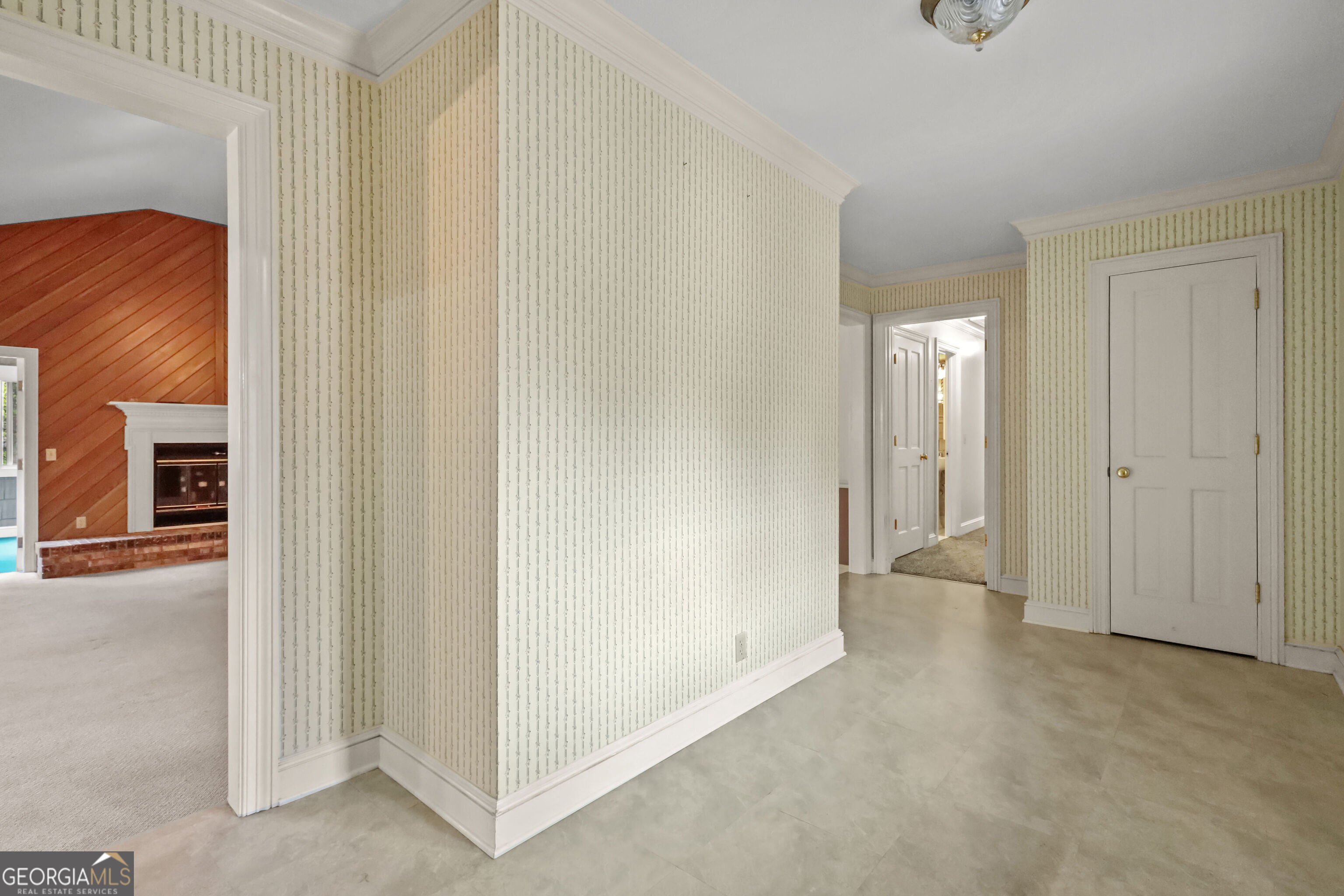 103 Cartwright Circle Brunswick, GA 31525 - Photo 5 of 54 a view of a hallway with wooden shelves