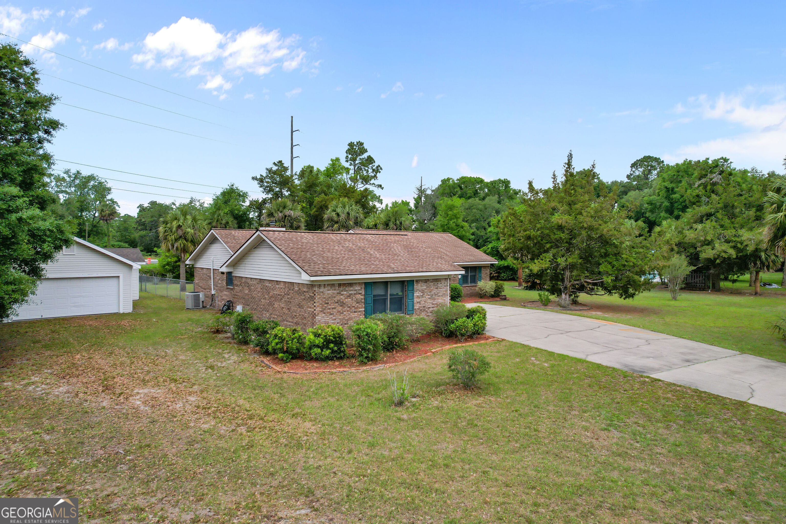 103 Cartwright Circle Brunswick, GA 31525 - Photo 51 of 54 a front view of a house with garden