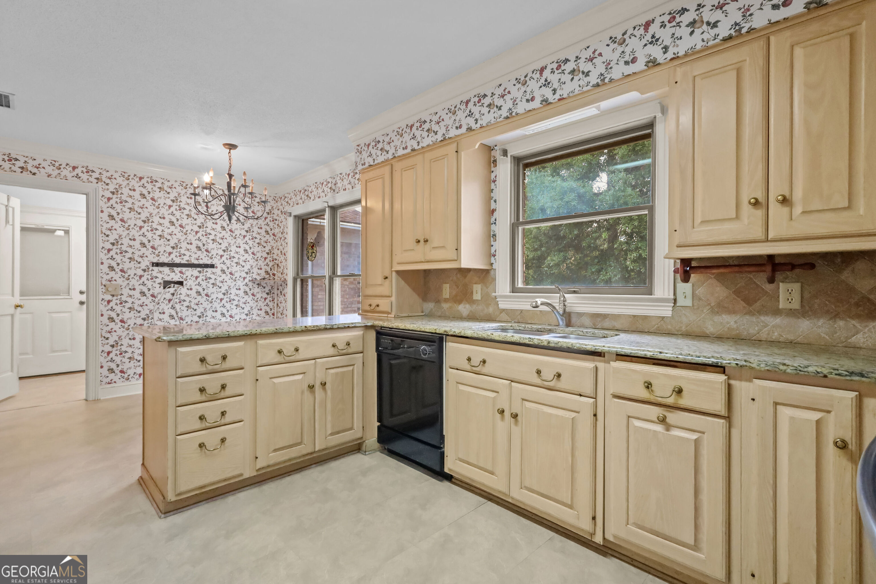 103 Cartwright Circle Brunswick, GA 31525 - Photo 7 of 54 a view of granite countertop white cabinets with wooden floors