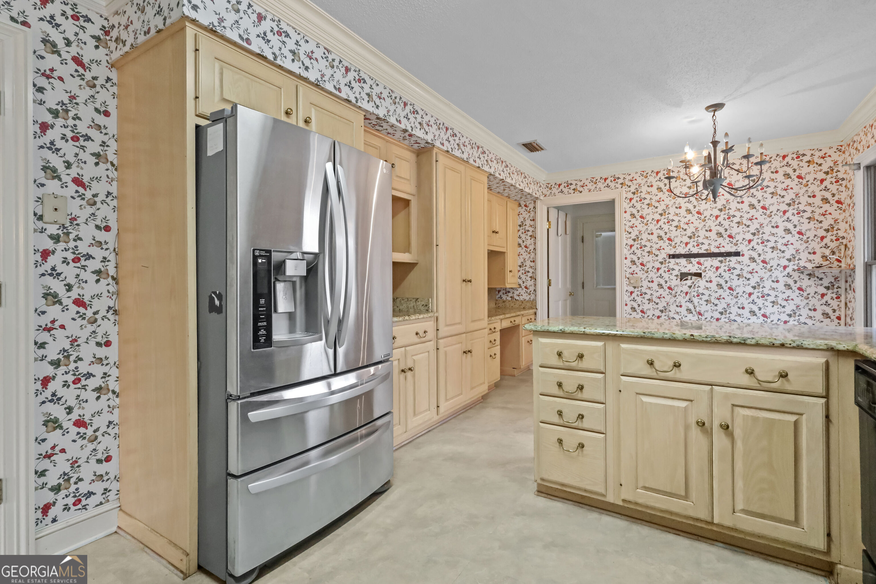 103 Cartwright Circle Brunswick, GA 31525 - Photo 10 of 54 a kitchen with white cabinets and stainless steel appliances