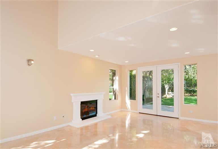 3909 Timberridge Road Moorpark, CA 93021 - Photo 8 of 22 a view of an empty room with a fireplace and a window