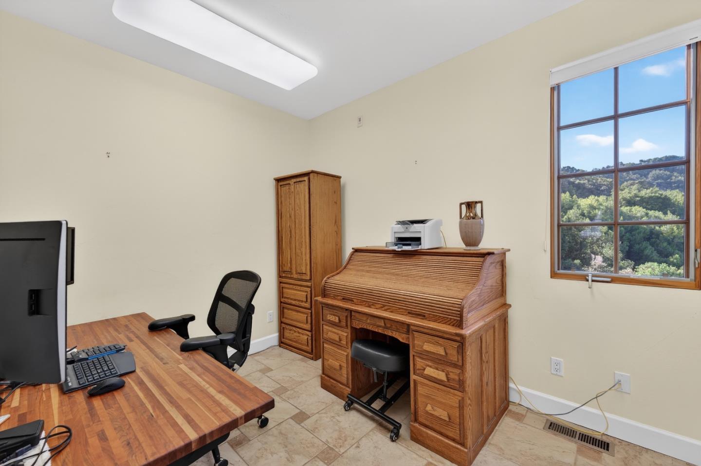 17599 Montebello Road Cupertino, CA 95014 - Photo 26 of 83 a room with furniture and a flat screen tv