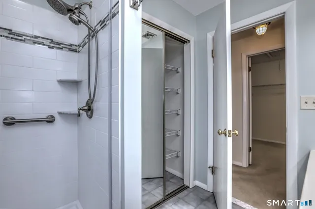 a bathroom with a glass shower door