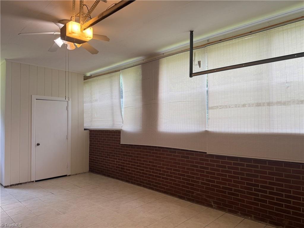 100 Kirk Road Greensboro, NC 27455 - Photo 27 of 42 Attached garage with windows surrounding exterior walls , tiled floor