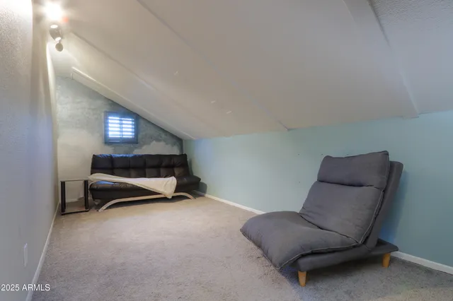 a room with a couch and a chair