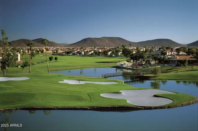 a view of a house with a yard and a garden