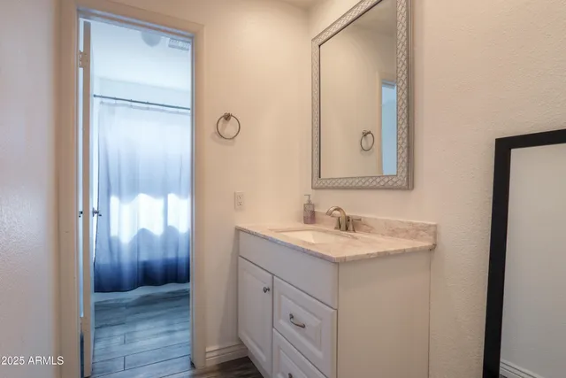 a bathroom with a sink and a mirror