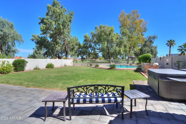 a view of a table and chairs in the garden