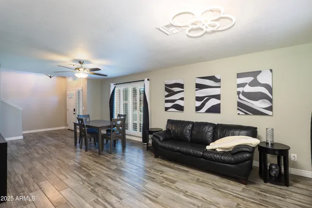 a view of a dining room with furniture and wooden floor