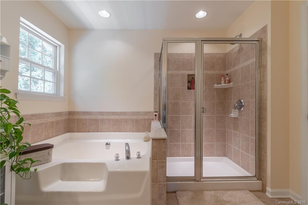 319 Lorraine Road Fort Mill, SC 29708 - Photo 22 of 32 a bathroom with a bathtub and a shower