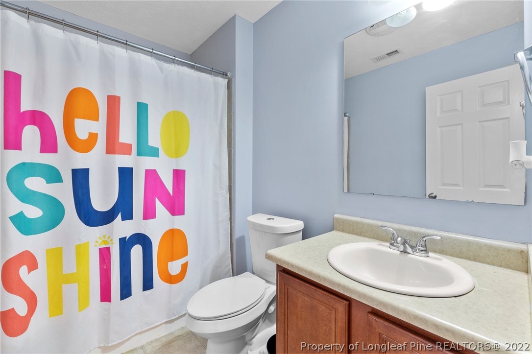 699 Cape Fear Road Raeford, NC 28376 - Photo 13 of 35 a bathroom with a sink and a mirror