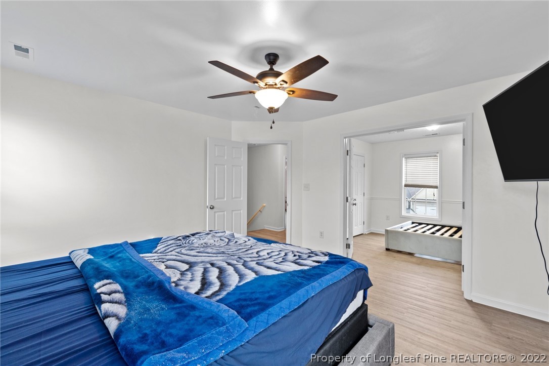 699 Cape Fear Road Raeford, NC 28376 - Photo 15 of 35 a bedroom with a bed and a flat screen tv