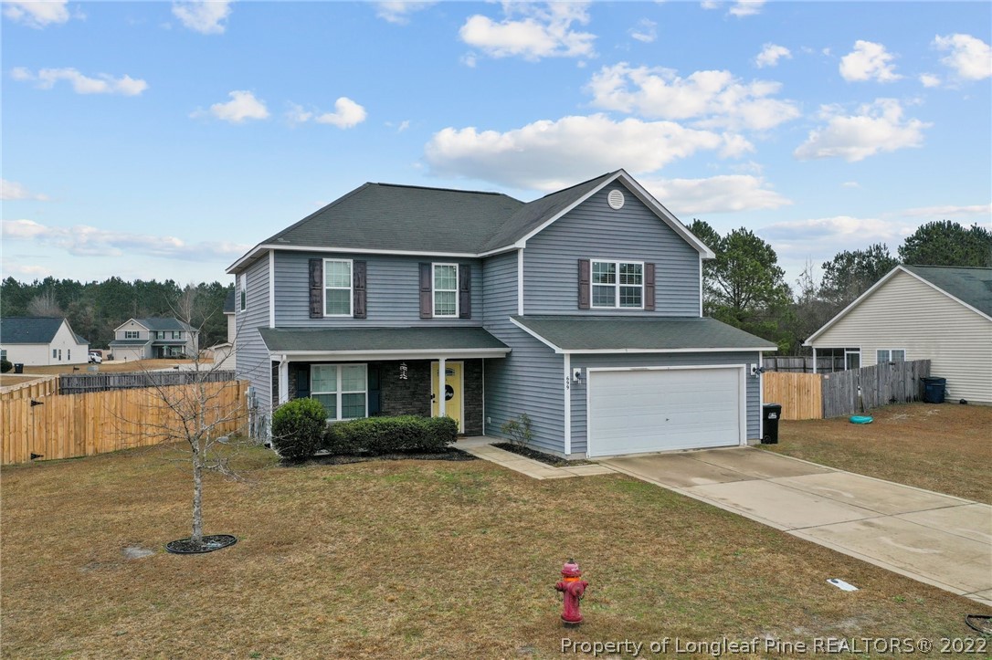 699 Cape Fear Road Raeford, NC 28376 - Photo 28 of 35 a front view of a house with a yard