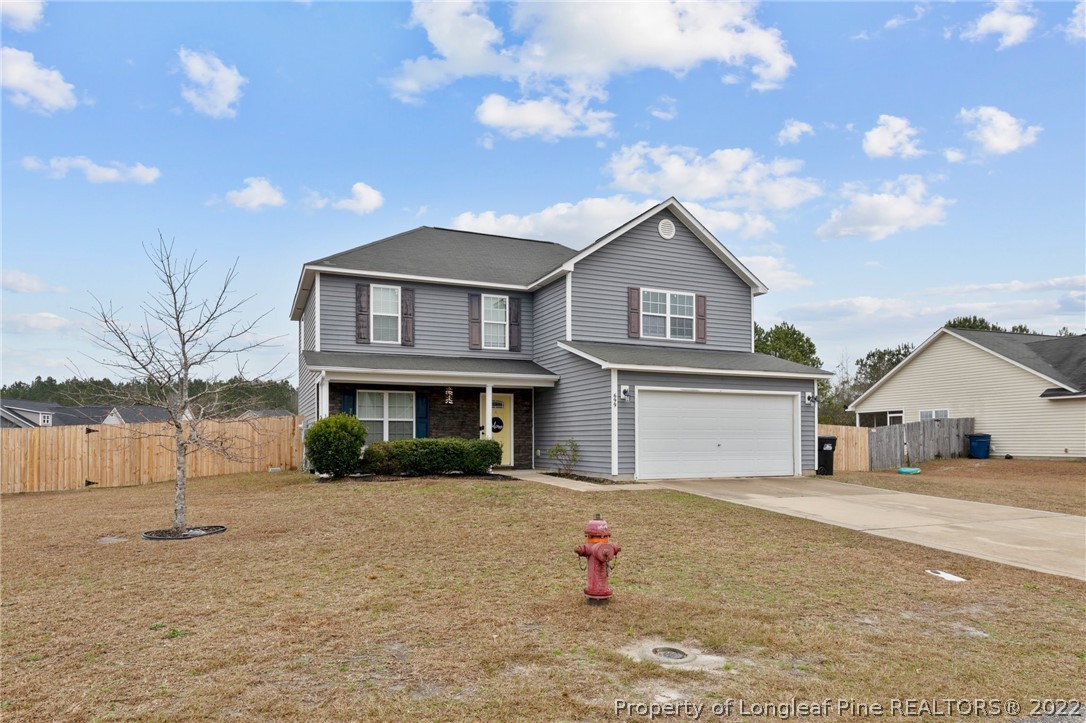 699 Cape Fear Road Raeford, NC 28376 - Photo 32 of 35 a front view of a house with a yard