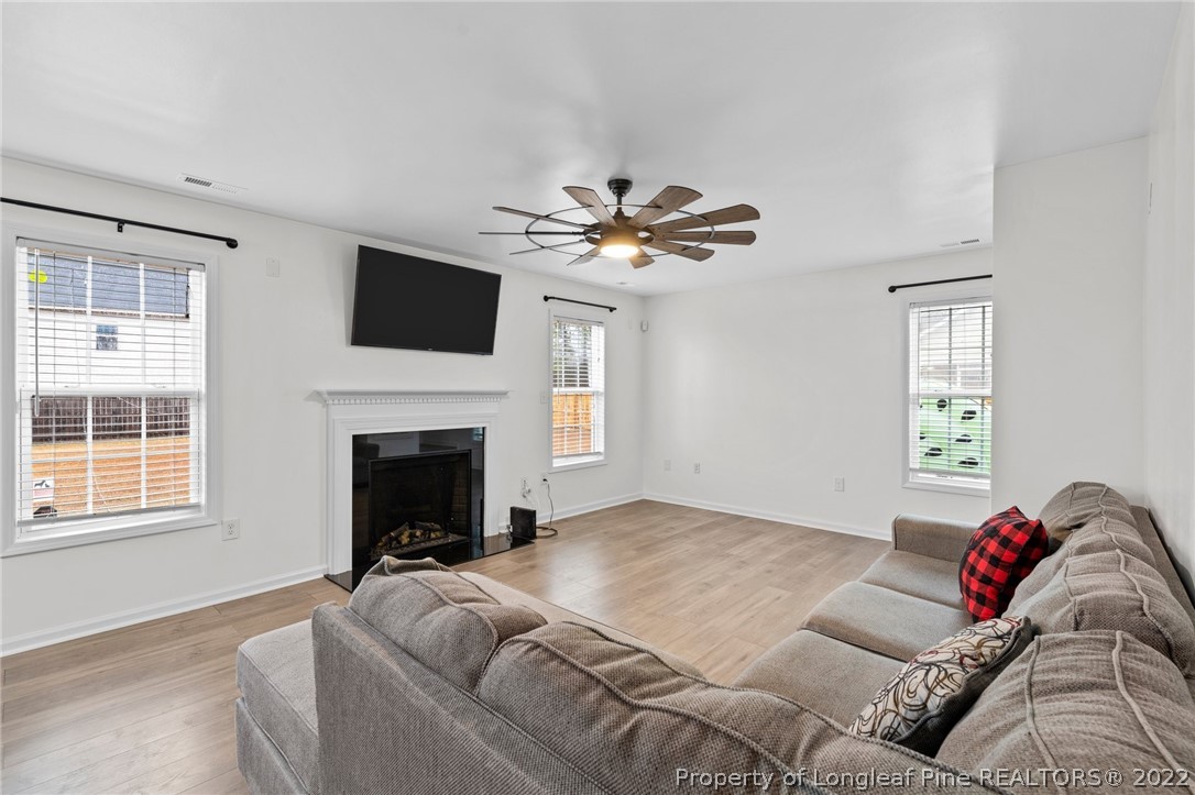 699 Cape Fear Road Raeford, NC 28376 - Photo 8 of 35 a living room with fireplace furniture and a flat screen tv