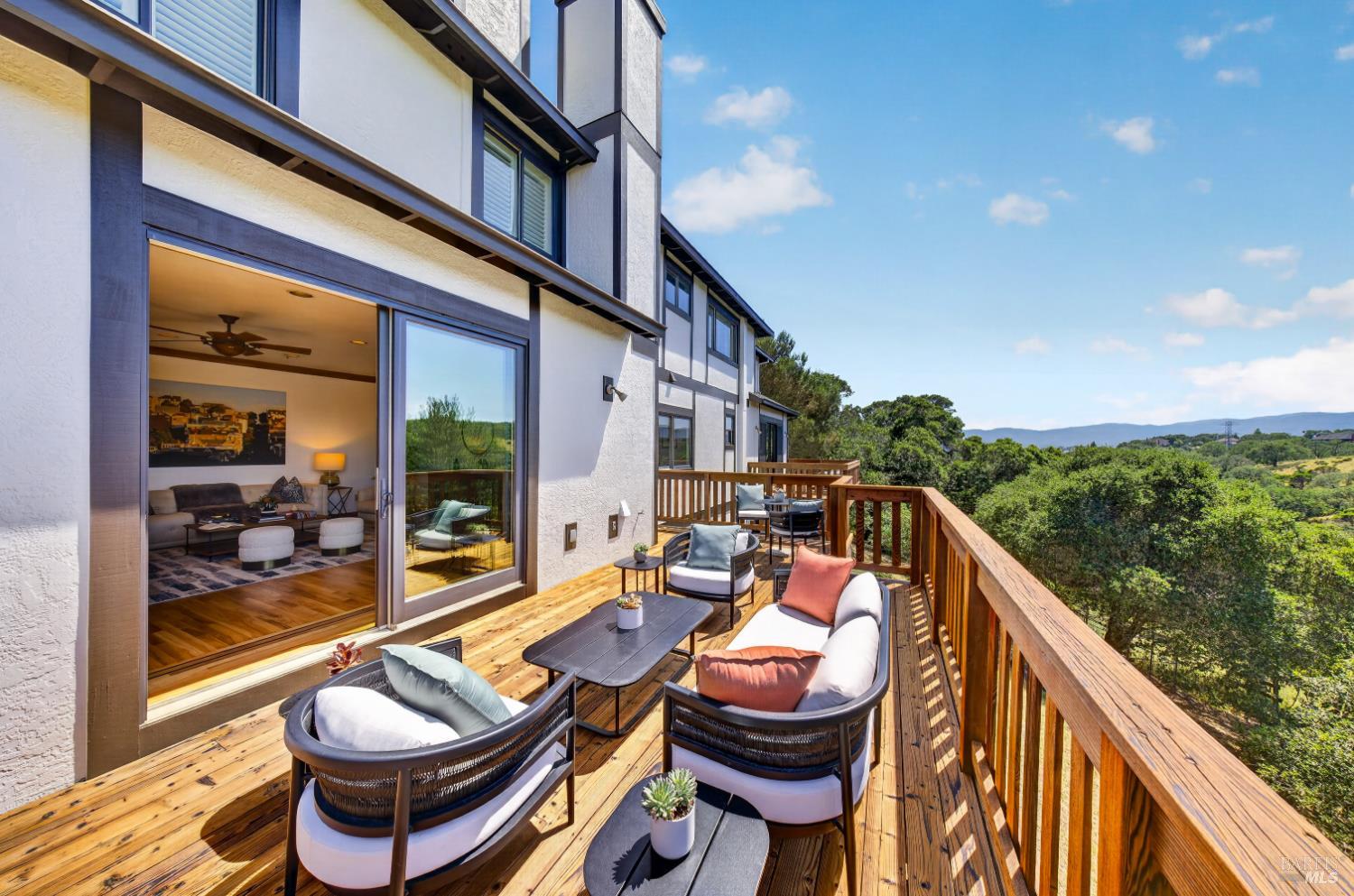 10 Lockton Lane Novato, CA 94945 - Photo 3 of 68 Expansive view deck off the kitchen, great room, and primary suite, designed for indoor-outdoor living and quiet enjoyment of the surrounding hills.