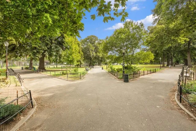 a view of a house with wooden fence