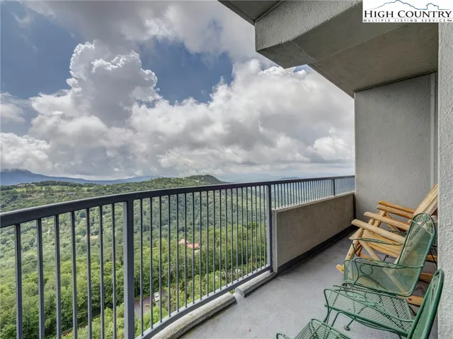 a balcony with wooden floor