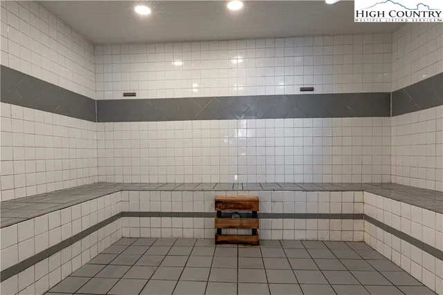 a bathroom with a bathtub and window