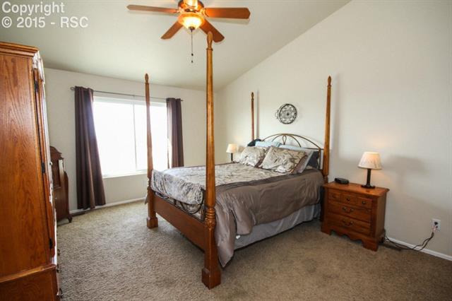 12475 Snaffle Bit Road Peyton, CO 80831 - Photo 17 of 35 Master Bedroom