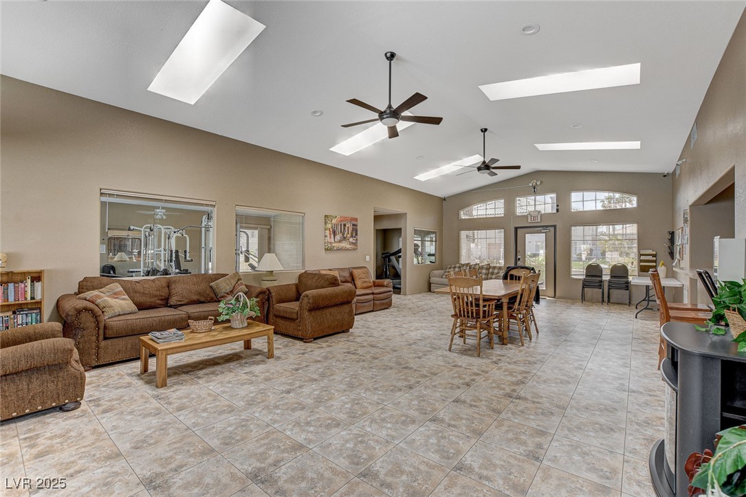 511 Rafkin Place Henderson, NV 89052 - Photo 56 of 64 Living area featuring a ceiling fan, a skylight, high vaulted ceiling, and light tile patterned floors