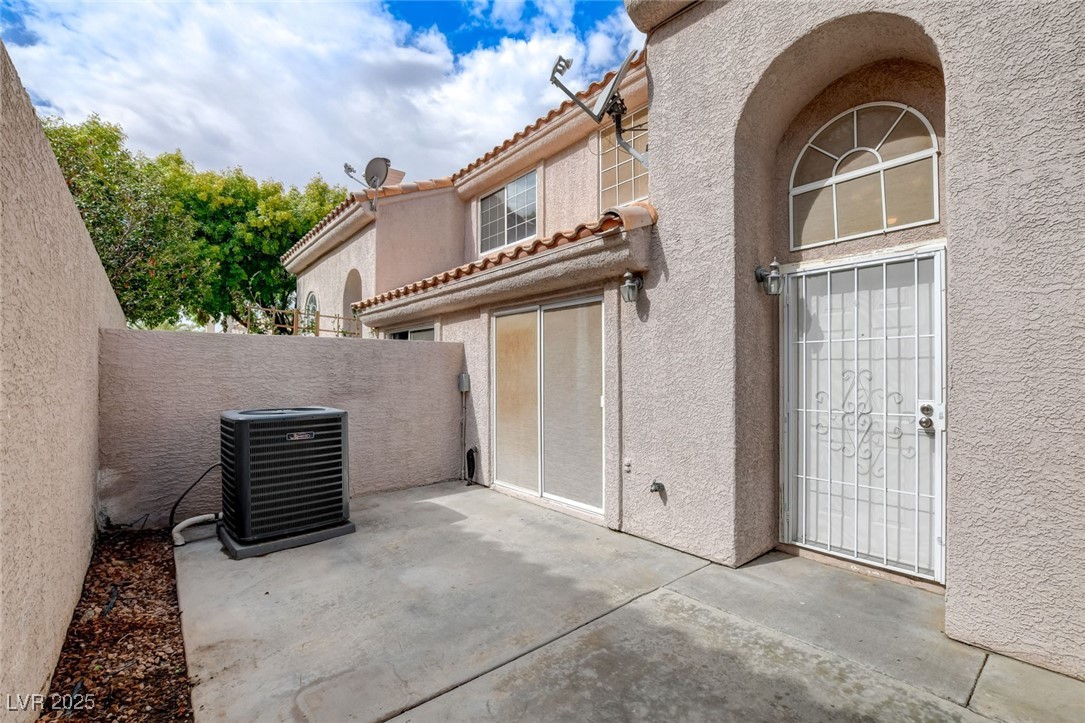 511 Rafkin Place Henderson, NV 89052 - Photo 6 of 64 View of exterior entry featuring a patio area, stucco siding, and a tile roof