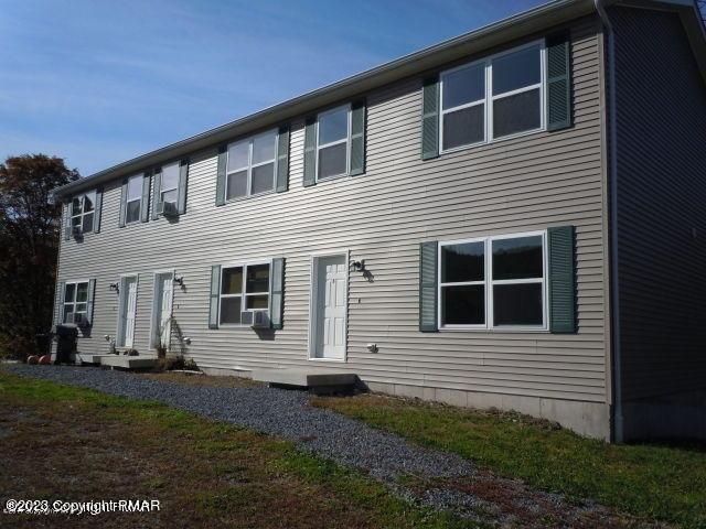 115 Balliet Court, Unit 3 Saylorsburg, PA 18353 - Photo 1 of 10 a front view of a house with a yard