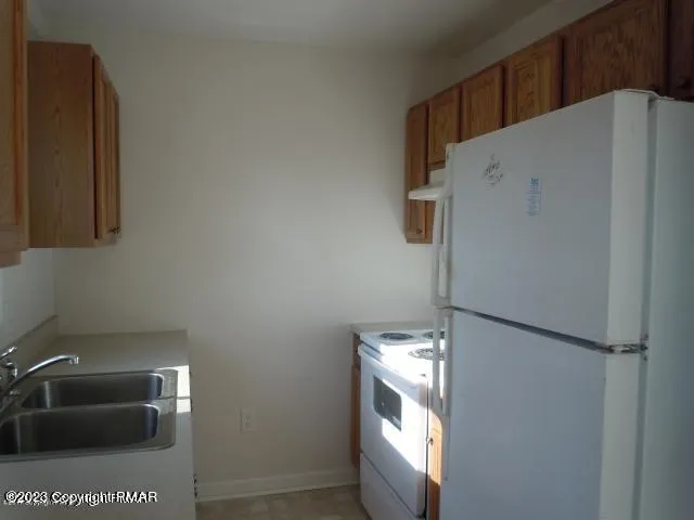 a view of storage and utility room with washer and dryer