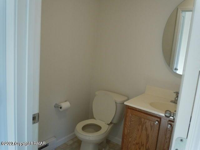 115 Balliet Court, Unit 3 Saylorsburg, PA 18353 - Photo 6 of 10 a white toilet sitting next to a shower