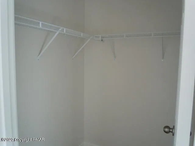 a view of an empty walk in closet