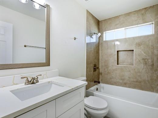 5034 West Fall Drive Midlothian, TX 76065 - Photo 27 of 40 Bathroom featuring a white vanity with an integrated sink, a light-toned countertop with veining, and brushed nickel fixtures