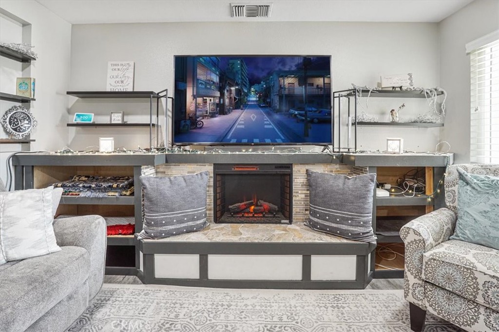 33962 Clark Lane Yucaipa, CA 92399 - Photo 11 of 48 a living room with furniture and a fireplace