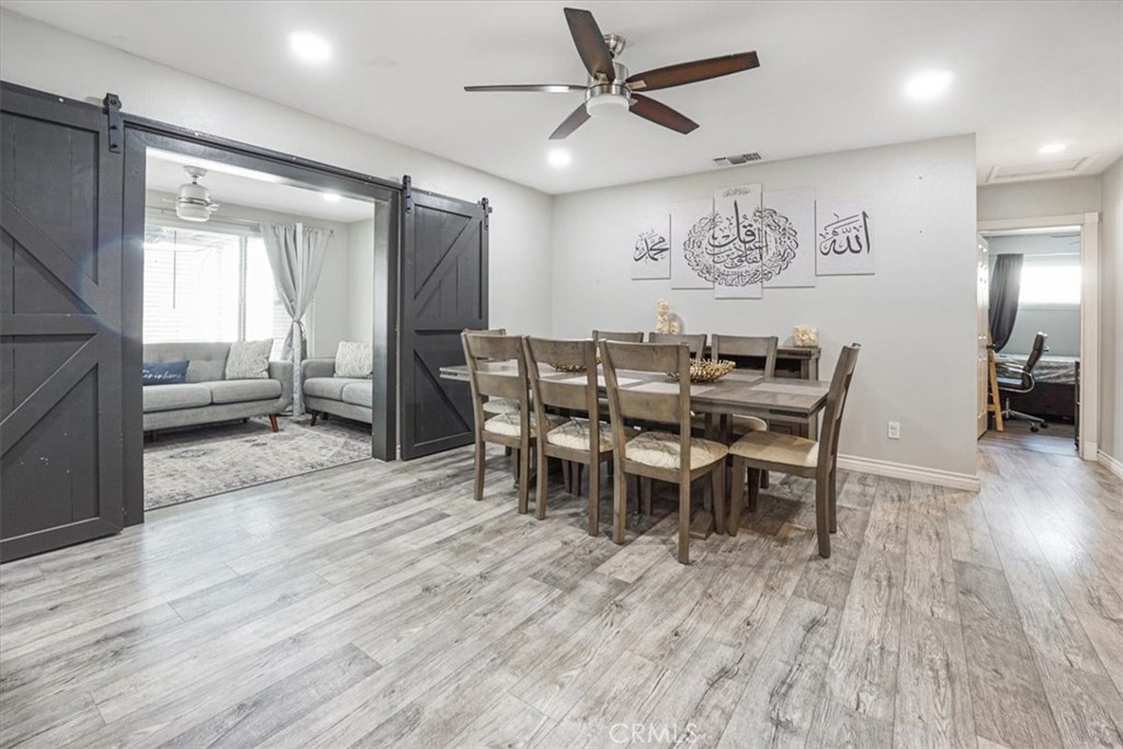 33962 Clark Lane Yucaipa, CA 92399 - Photo 14 of 48 a view of a a dining room with furniture window and wooden floor
