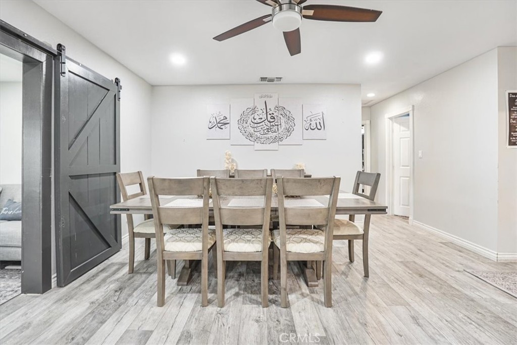 33962 Clark Lane Yucaipa, CA 92399 - Photo 15 of 48 a view of a dining room with furniture and wooden floor